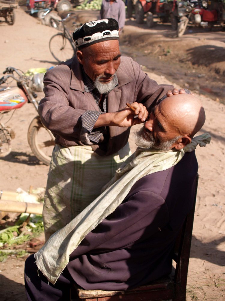 barber-giving-a-shave-kashgar-china