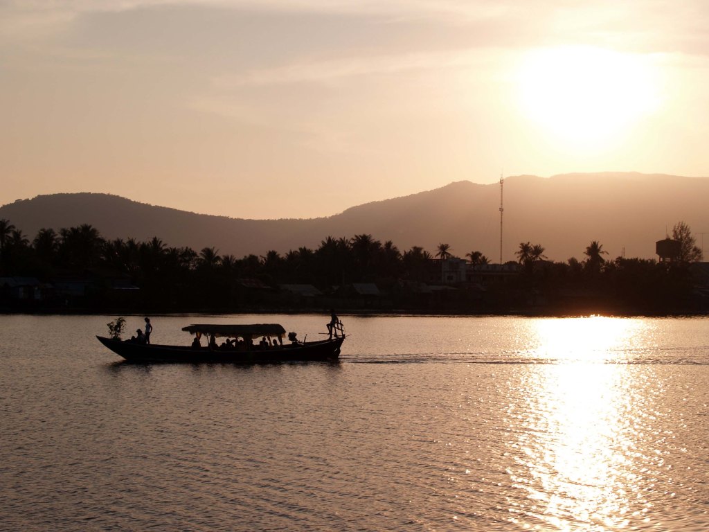 Cambodian river boat at sunset