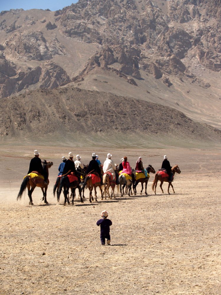 hild-walking-behind-horses-tajikistan