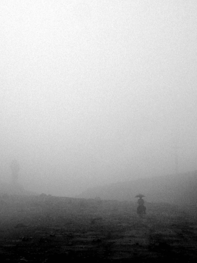 Horse rider in fog Kyrgyzstan