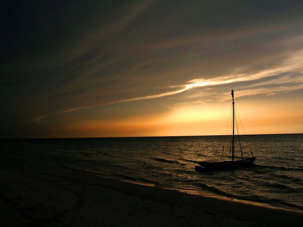 Mexican beach sunset with a boat