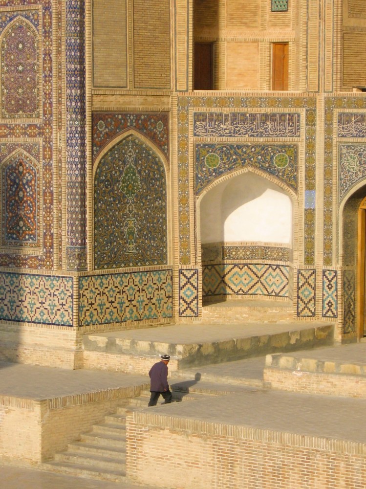 uzbek-man-ascending-steps-into-mir-i-arab-medressa
