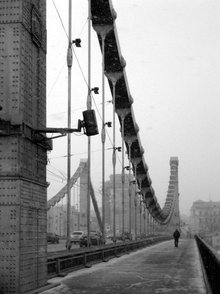 man walking down the Winter streets of Moscow Russia